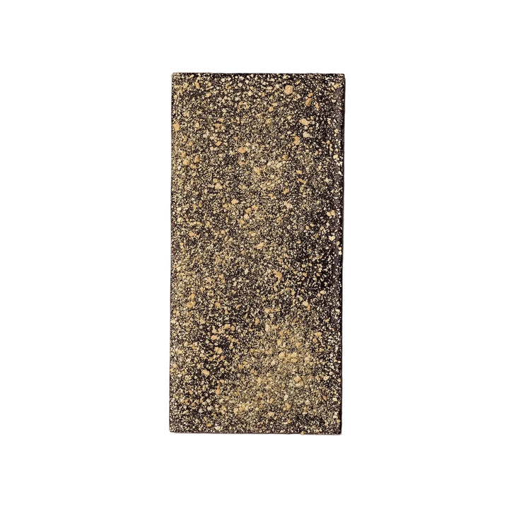Rectangular black and gold speckled chocolate bar.