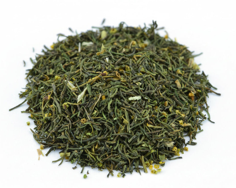 Dry green tea leaves on a white background