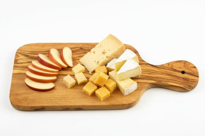 Wooden cutting board with handle on a white background